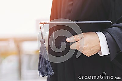 Graduation,Student hold hats in hand during commencement success graduates of the university,Concept education congratulation.Grad Stock Photo