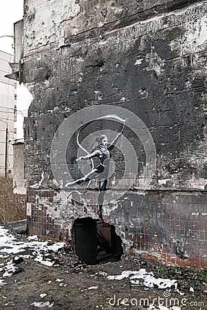 Graffiti by Banksy on a destroyed house in Irpin, Ukraine Editorial Stock Photo