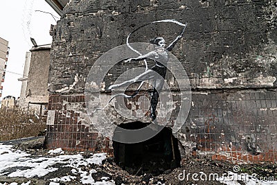 Graffiti by Banksy on a destroyed house in Irpin, Ukraine Editorial Stock Photo
