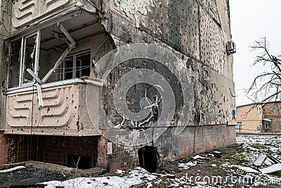 Graffiti by Banksy on a destroyed house in Irpin, Ukraine Editorial Stock Photo