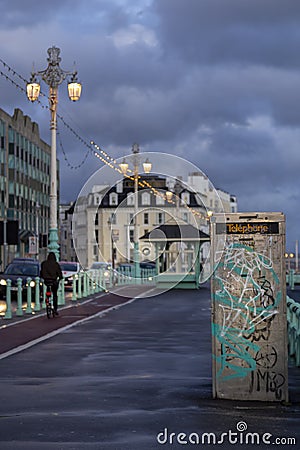 Graffiti on Brighton promenade at dusk Editorial Stock Photo