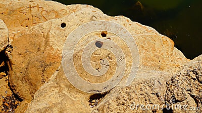 Graffiti carved into the rocks at Grapevine Lake Texas. Stock Photo