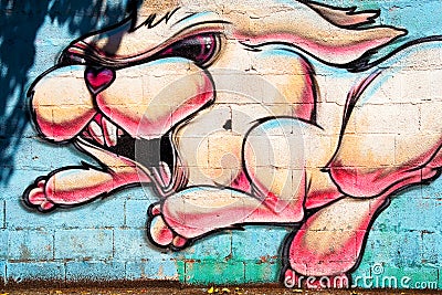 Graffiti of a colorful and funny rabbit Editorial Stock Photo