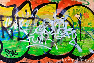 Graffiti colours. Urban art message. The art of urban vandalism. Stock Photo
