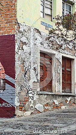 Graffiti covered wall with windows Editorial Stock Photo