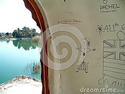 Graffiti in a Sadaam-era building in Baghdad Editorial Stock Photo