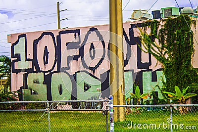 Graffiti Message on a Side of a Building Editorial Stock Photo