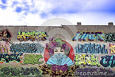 Graffiti on an old brick building . Editorial Stock Photo