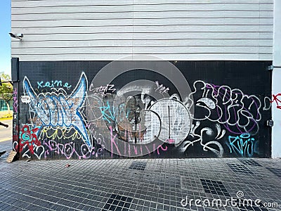 Graffiti painted black textured wall street urban art Editorial Stock Photo
