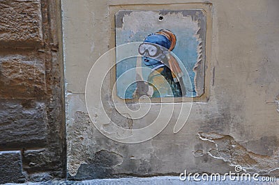 Graffiti painting on wall: modern scene of Jan Vermeer `Girl with pearl earring` Stock Photo