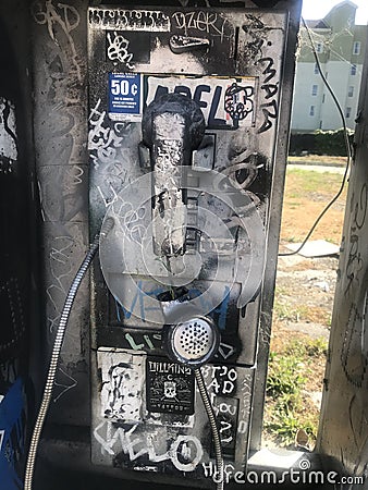 Graffiti Public Phone Grunge Burnt Pay Phone vandalized retro Editorial Stock Photo