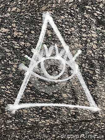 Graffiti signifying the all-seeing eye of the so-called Illuminati Stock Photo