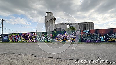 Graffiti style murals on an outside wall of Deep Ellum Storage for 2023 Trigger Fingers event in Deep Ellum, Texas. Editorial Stock Photo