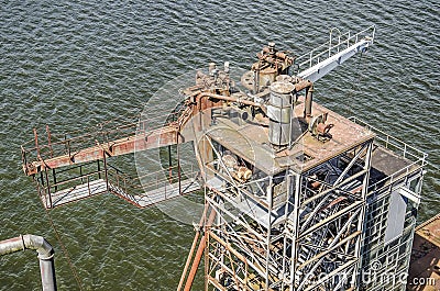 Grain elevator and harbour waves Editorial Stock Photo