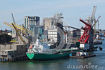 Grain elevator with terminal, cranes and ship Stock Photo