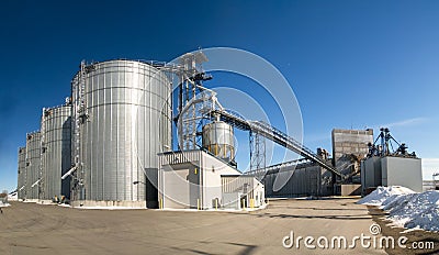 Grain elevators at a shipping port Stock Photo