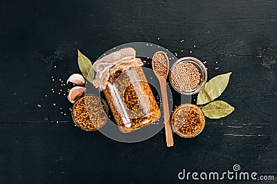Grain Mustard. Spices On a dark wooden background. Stock Photo