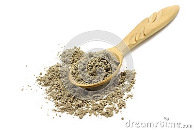 Grain refinement of cardamom in wooden spoon Stock Photo