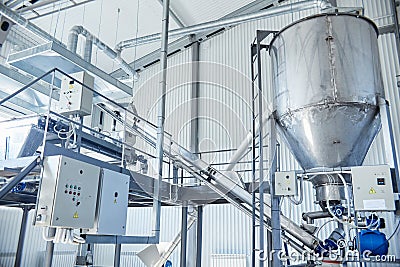 Grain sorting machine and storage on the factory Stock Photo