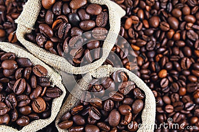 Grains of coffee in bags. Grains of coffee background Stock Photo