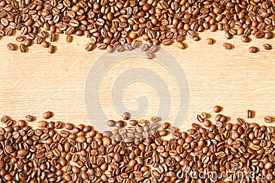 Grains of invigorating coffee on a wooden table Stock Photo