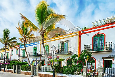 Gran Canaria Spain. December 6, 2018. Gran Canaria streets. Beautiful, vibrant multi-colored houses and palm trees in a seashore Editorial Stock Photo