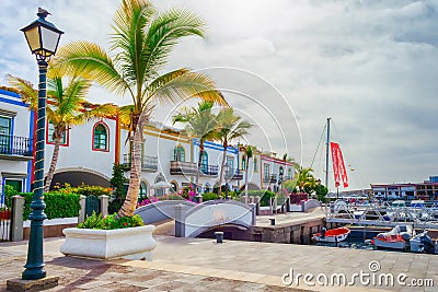 Gran Canaria Spain. December 6, 2018. Gran Canaria streets. Beautiful, vibrant multi-colored houses and palm trees in a seashore Editorial Stock Photo