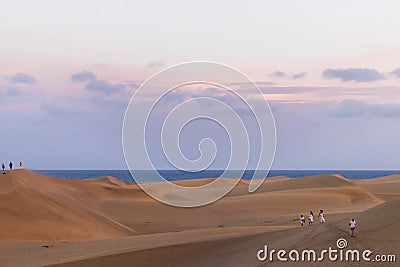 Walking through Maspalomas dunes at sunset Editorial Stock Photo