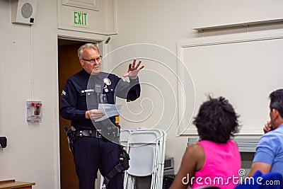 Granada Hills, California / USA - February 25, 2020: Senior Lead Officer Sellers speaks to residents at a neighborhood watch LAPD Editorial Stock Photo