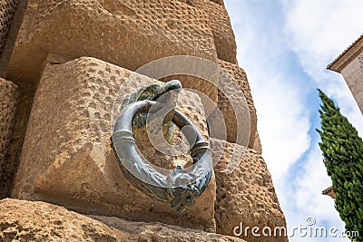 Decorative Metal Ring with Eagle head on the facade of Palace of Charles V at Alhambra - Granada, Andalusia, Spain Editorial Stock Photo