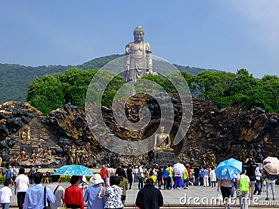Grand Buddha statue with murals in the front Editorial Stock Photo