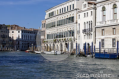 Grand Canal, historic decorative tenement houses, floating boats, Venice, Italy Editorial Stock Photo