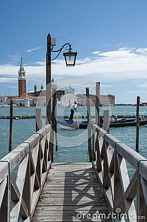 Grand canal jetty and gondolier Editorial Stock Photo