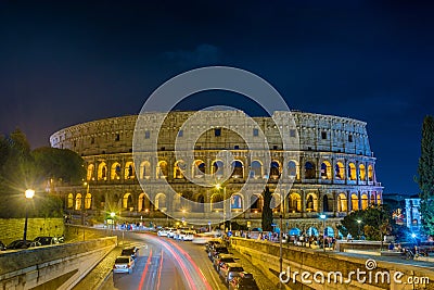 The Grand Colosseum the largest amphitheater built by the Roman Empire at night in Rome - Italy Stock Photo