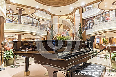 Grand Foyer and baby Grand piano MS Queen Elizabeth. Editorial Stock Photo