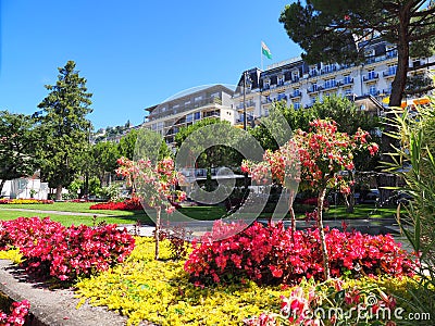 Grand Hotel Suisse Majestic and flowers in Montreux city, Switzerland Editorial Stock Photo