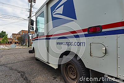 GRAND LEDGE, UNITED STATES - Jun 21, 2020: Side View of USPS Delivery Vehicle Editorial Stock Photo