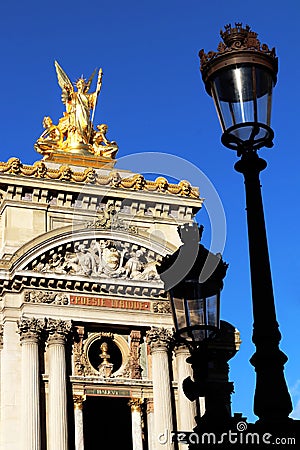 Grand Opera Paris Garnier golden statue and facade front view in front of old Lampposts france Stock Photo