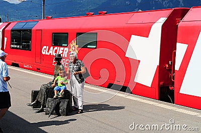 Grand parents posing with grand children in front of Glacier Exp Editorial Stock Photo