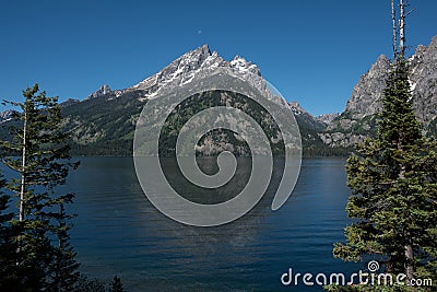 Grand Teton Mountains Rise above Jenny Lake Stock Photo