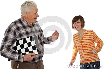 Grandad called granddaughter to play a chess Stock Photo