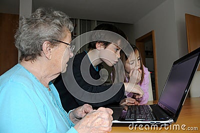 Grandma gets a lesson in computer operation Stock Photo