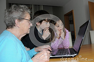 Grandma gets a lesson in computer operation Stock Photo