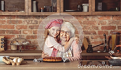 Granddaughter hug her happy grandmother Stock Photo