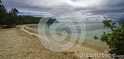 People taking ocean bath on the beautiful beach of Petit Havre beach in south on Grande-Terre on Guadeloupe island Editorial Stock Photo