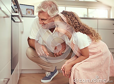 Grandfather and girl child in kitchen cooking oven food together and excited for results. Happy family, learning and Stock Photo