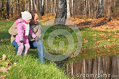 Grandfather with granddaughter in wood in autumn Stock Photo