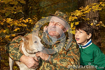 Grandfather, grandson and dog Stock Photo