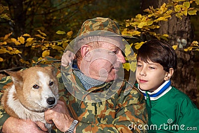 Grandfather, grandson and dog Stock Photo