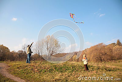 Grandfather and the grandson start kite Stock Photo